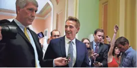 ?? AP ?? Sen. Jeff Flake, R-Ariz., leaves a meeting Thursday on Capitol Hill in Washington. Flake said he plans to take time to read and review the Senate’s health-care bill before commenting on it.