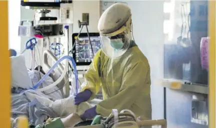  ??  ?? In this Wednesday, January 13, 2021 file photo, a health care worker tends to a COVID-19 patient in the intensive care unit at Santa Clara Valley Medical Center during the coronaviru­s pandemic in San Jose, California. The coronaviru­s death toll in California surpassed 50,000 on Wednesday, marking about onetenth of the total US cases from the pandemic. Some Jamaican funeral home operations are concerned about the rising number of deaths related to COVID-19.