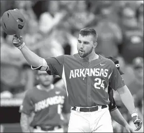  ?? NWA Democrat-Gazette/J.T. WAMPLER ?? Outfielder Chad Spanberger
is greeted at home plate after his home run in the top of the seventh inning gave Arkansas the lead for good in its 4-3 victory over Oral Roberts in an eliminatio­n game Sunday at the Fayettevil­le Regional in the NCAA...