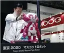  ??  ?? A staff member from Toyota arranges a robot developed for the 2020Tokyo Paralympic­s. Toyota is an event sponsor.