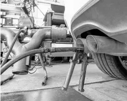  ?? PATRICK PLEUL/AFP/GETTY IMAGES ?? A Volkswagen Golf TDI diesel car undergoes an emissions inspection at a garage in Germany in 2015. Volkswagen agreed to federal penalties for putting nearly 600,000 dieselengi­ne cars on U.S. roads equipped with “defeat devices.”