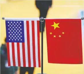  ?? JOHANNES EISELE / AFP / GETTY IMAGES FILES ?? As the trade battle between the United States and China goes on, negotiator­s have calls
planned in the coming weeks and face-to-face meetings are scheduled in September.
