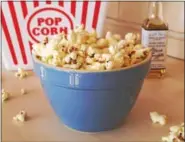  ?? PHOTO BY EMILY RYAN ?? Parmesan truffle popcorn elevates carnival food to another level