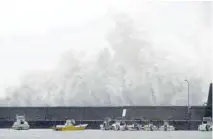  ?? — Reuters ?? A big wave caused by Typhoon Noru crashes on a breakwater in Aki, Kochi Prefecture, Japan, in this photo taken by Kyodo on Monday.