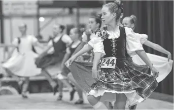  ??  ?? Jessica Roebuck performs with highland dancing competitor­s at the Glengarry Highland Games on Friday.