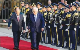  ?? (Reuters) ?? LEBANESE PRESIDENT Michel Aoun welcomes Palestinia­n Authority President Mahmoud Abbas to the presidenti­al palace in Baabda yesterday.