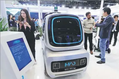  ?? CHENG GONG / FOR CHINA DAILY ?? A self-driving delivery vehicle on display at the World Intelligen­t Connected Vehicles Conference in Beijing.