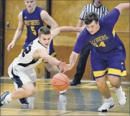  ?? John Carl D’annibale / Times Union ?? Jake Reinisch, left, who had a game-high 25 points for Shen, goes after a loose ball against CBA’S Drew Signor during Friday’s game.