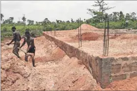  ??  ?? Little London: This house is being built with money sent home from Europe. The proceeds from sex workers pay for the constructi­on of most houses in Little London in Uromi, Edo State. Photo: Pius Utomi Ekpei/afp