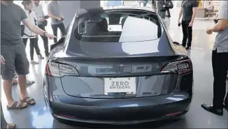  ?? Allen J. Schaben Los Angeles Times ?? THE MODEL 3 is “extremely noisy” at 50 to 60 mph, said a Calabasas man who also owns a Tesla Model S. “This one is not as aerodynami­c; it’s definitely more noisy inside because of the wind.”