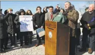  ?? Erik Trautmann / Hearst Connecticu­t Media ?? State Sen. Will Haskel, State Rep. Tony Hwang and State Rep. Jonathan Steinberg tout a bill that would ban single-use plastic bags in Conn., while Westport First Selectman Jim Marpe and supporters look on at Compo Beach in Westport on Saturday.