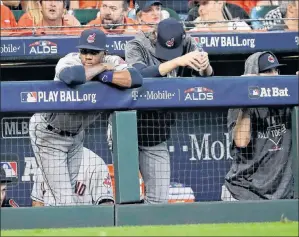  ?? AP PHOTO ?? Cleveland Indians players watch from the dugout during the ninth inning of their 7-2 loss in Game 1 of an American League Division Series baseball game against the Houston Astros, in Houston.