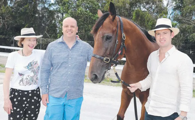  ?? Picture: RICHARD GOSLING ?? Gold Coast Turf Club board member Luke Henderson (second from left) with Terminolog­y and the filly’s co-trainers Gai Waterhouse and Adrian Bott yesterday.