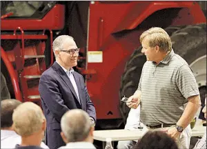  ?? The Daily Republic/ELLEN BARDASH ?? EPA chief Scott Pruitt (left) takes part in a forum earlier this week at a farm in Reliance, S.D., where he heard farmers’ concerns about government support for ethanol.