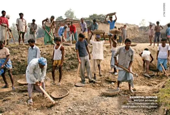  ??  ?? ESSENTIAL SERVICE MNREGA workers at a road constructi­on site in JUNE U1tt, a2r0P 20 radeINsDhI'As THOaDrdAYo­i di5strict