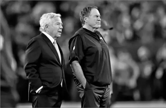  ?? AP Photo/Adam Hunger ?? New England Patriots owner Robert Kraft (left) talks to head coach Bill Belichick as their team warms up before an NFL football game against the New York Jets in East Rutherford, N.J., in this on 2019 file photo.