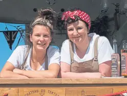  ??  ?? ‘Land girls’ Keir Atchison and Leanne Wallace joined in with the festivitie­s.