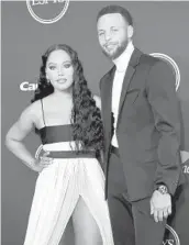  ?? JORDAN STRAUSS/INVISION ?? Stephen Curry, seen July 20 with wife Ayesha, has released a kids’ book,“I Have a Superpower.”