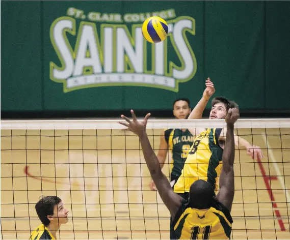  ?? DAX MELMER ?? Brendan MacKenzie leaps for a spike as the St. Clair Saints men’s volleyball team practises at the Sportsplex in preparatio­n for a game Saturday against the Humber Hawks.