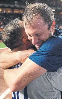  ?? WALLY SKALIJ GETTY IMAGES ?? Dodgers manager Dave Roberts and occasional closer Max Scherzer celebrate after eliminatin­g the 107-win Giants.