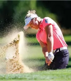  ?? JONATHAN FERREY/GETTY IMAGES ?? Canadian Brooke Henderson hits out of the bunker on the sixth hole during the second round of the LPGA Cambia Portland Classic on Friday.