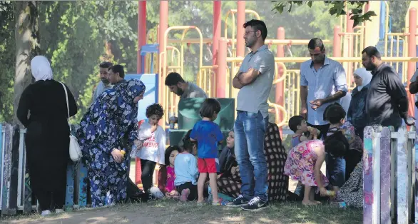  ?? SHANE MACKICHAN ?? About 50 Syrian refugees are homeless after a fire engulfed a three-storey apartment block in the 500-block Cottonwood Avenue in Coquitlam on Thursday.