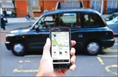  ?? DANIEL LEAL-OLIVAS/AFP ?? It will be the black cab and not Uber if the ride hailing firm doesn’t convince London authoritie­s it has resolved safety issues to get a new operating licence.