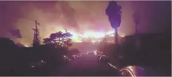  ?? PHOTO COURTESY OF KEASLER FAMILY ?? TOTAL LOSS: A picture frame from video shows John and Linda Keasler’s home being consumed by a wildfire yesterday in Ventura, Calif.