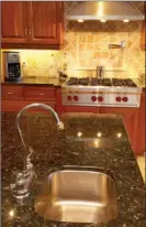  ?? Metro Creative ?? Countertop­s come in various materials, not all of which should be treated the same way. Quartz, granite, marble, laminate, and tile countertop­s require different types of maintenanc­e.