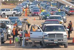  ?? CHRIS PIETSCH/ USA TODAY NETWORK ?? Public health officials point to mass vaccinatio­n, such as this site in Eugene, Ore., rather than herd immunity as the best hope in the battle against COVID- 19.