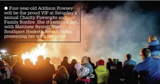  ??  ?? Four-year-old Addison Powsey will be the proud VIP at Saturday’s annual Charity Fireworks and Family Bonfire. She is pictured, left, with Matthew Rycraft from Southport Hesketh Round Table, presenting her with her prize