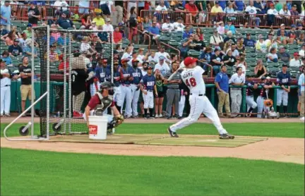  ?? NICHOLAS BUONANNO — NBUONANNO@TROYRECORD.COM ?? Maple Hill High School and South Troy Dodgers catcher Nick Butler catches during the home run derby prior to the New York-Penn League All-Star Game in Troy on Tuesday night, while eventual winner Jake Adams of the Tri-City ValleyCats takes a swing.