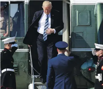  ?? SUSAN WALSH, THE ASSOCIATED PRESS ?? U.S. President Donald Trump leaves Marine One as he heads to Air Force One at Andrews Air Force Base in Maryland on Thursday. Trump was heading to Montana for a rally.