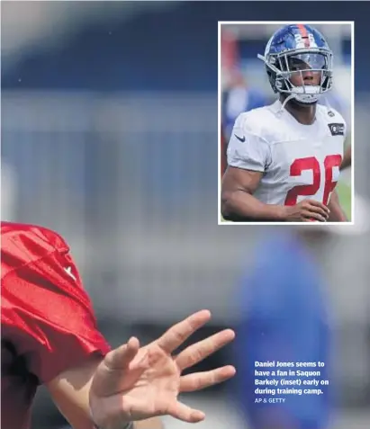  ?? AP & GETTY ?? Daniel Jones seems to have a fan in Saquon Barkely (inset) early on during training camp.