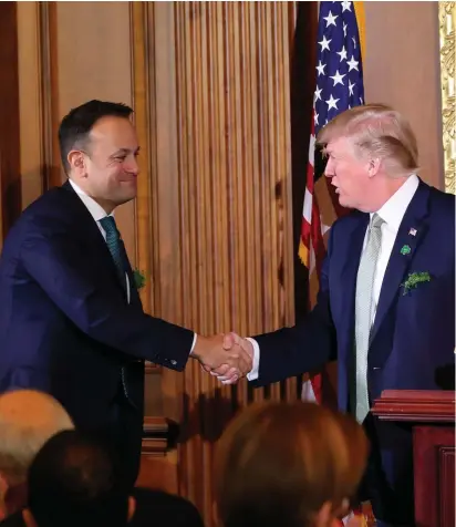  ?? Photo: Niall Carson/PA Wire ?? US President Donald Trump shakes hands with Taoiseach Leo Varadkar during the Speaker’s Lunch at Capitol Hill in Washington DC.