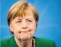  ?? AFP ?? Angela Merkel dio una inusual conferenci­a por la madrugada para anunciar el nuevo cierre/