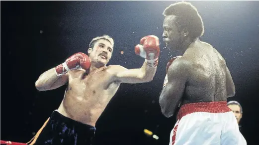  ?? / THE RING MAGAZINE/GETTY IMAGES ?? Gerrie Coetzee hooks Michael Dokes during their fight in Ohio, US. Coetzee stunned the Americans to win the WBA World heavyweigh­t title. The SA legend had 21 KOs in 33 wins against six losses and a draw.