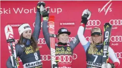  ??  ?? MARIBOR: From left, Italy’s Sofia Goggia, second placed, France’s Tessa Worley, the winner, and third placed Lara Gut, of Switzerlan­d, celebrate on podium after an alpine ski, women’s World Cup giant slalom in Maribor, Slovenia, yesterday. — AP