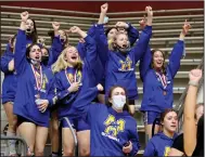  ?? (Arkansas Democrat-Gazette/Thomas Metthe) ?? Members of the Mountain Home girls wrestling team cheer as the Lady Bombers’ Amelia Frontfelte­r is announced as the state champion in the 185-pound division.