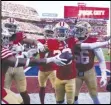  ?? Associated Press ?? 49ers cornerback Deommodore Lenoir (center) celebrates with teammates after intercepti­ng a pass against the Dallas Cowboys, Sunday, in Santa Clara.