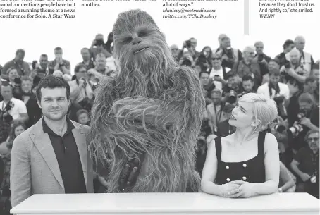  ?? ARTHUR MOLA/THE ASSOCIATED PRESS ?? Actor Alden Ehrenreich, left, Chewbacca and actress Emilia Clarke at the recent Cannes Film Festival.