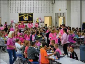  ?? MARIAN DENNIS– DIGITAL FIRST MEDIA ?? Fifth-, sixth- and seventh-graders at Spring-Ford Area School District sported pink on Friday to celebrate their support for breast cancer awareness. Students were treated to free hot dogs for lunch after donating thousands of pairs of shoes to...