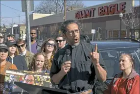  ?? Pam Panchak/Post-Gazette ?? Rev. Vincent Kolb of Sixth Presbyteri­an Church in Squirrel Hill addresses the crowd Wednesday at a rally across the street from the Giant Eagle along Murray Avenue.