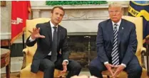  ?? - Reuters ?? MEETING: French President Emmanuel Macron, left, speaks as US President Donald Trump looks on during their meeting in the Oval Office following the official arrival ceremony for Macron at the White House in Washington, U.S., April 24, 2018.