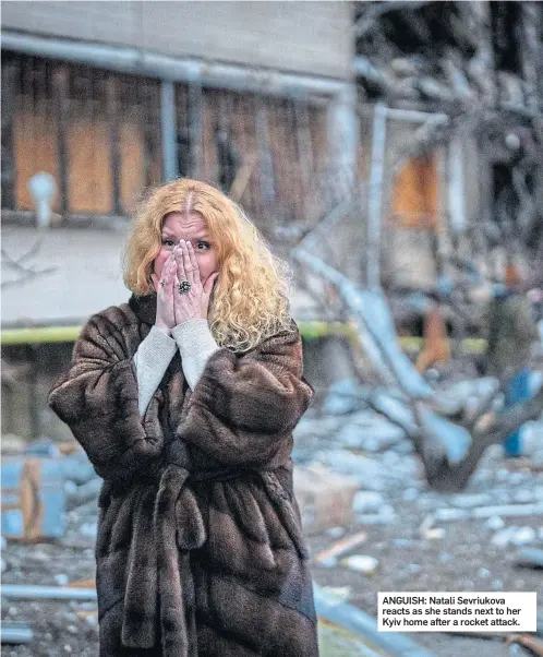  ?? ?? ANGUISH: Natali Sevriukova reacts as she stands next to her Kyiv home after a rocket attack.