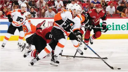  ?? —AFP ?? GLENDALE: Andrew MacDonald #47 of the Philadelph­ia Flyers skates with the puck during the third period of the NHL game against Arizona Coyotes at Gila River Arena on Saturday in Glendale, Arizona. The Coyotes defeated the Flyers 4-3 in overtime.