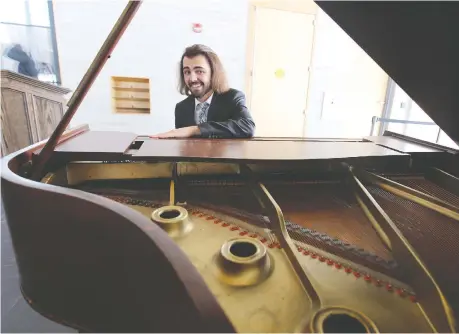  ?? .PHOTOS: NICK BRANCACCIO ?? University of Windsor student Samuel Fedele played a vintage Heintzman & Co. baby grand piano — originally purchased by the Hiram Walker family nearly 100 years ago — during a Friday recital in the lobby of Windsor City Hall.