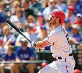  ?? RONALD MARTINEZ / GETTY IMAGES ?? Joey Gallo hits a three-run home run Sunday in the second inning of the Rangers’ 8-1 win over the A’s. Gallo finished with a career-high five RBIs.