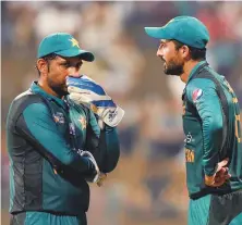  ?? AFP ?? Pakistan’s Junaid Khan discusses with captain Sarfraz Ahmad (left) during the match against Bangladesh at the Shaikh Zayed Stadium in Abu Dhabi on Wednesday.