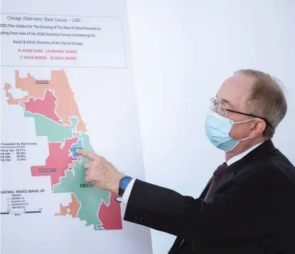  ?? ANTHONY VAZQUEZ/SUN-TIMES ?? Cartograph­er Ed Sarpolis on Nov. 22 points out the Asian ward on a map loosely showing the different areas of representa­tion of wards during a press conference where the Aldermanic Black Caucus discussed the remapping process.
